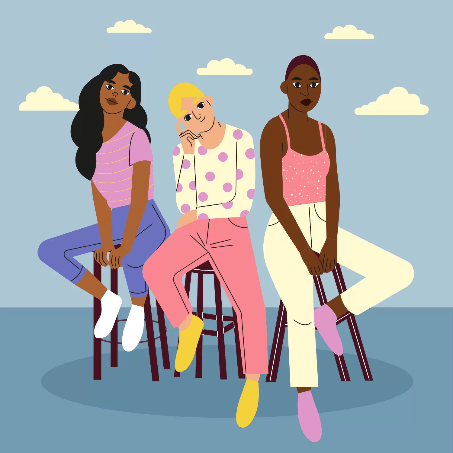 Three diverse people sitting together on stools